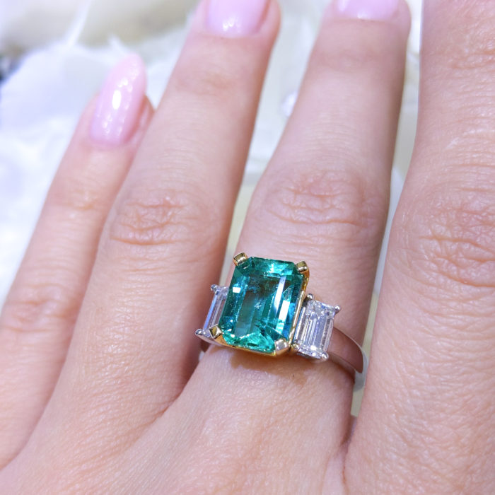 Transparent Green Emerald 3.16ct Cut with Two Emerald Cut Diamond 0.96ct surrounded 14K White Gold.