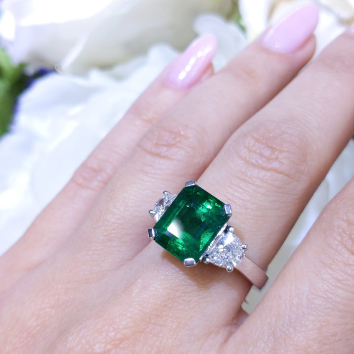 4.99ct Eerald Cut Emerald with Two Half Moons Cut Diamond Side Stone